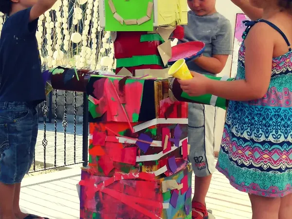 A cardboard robot built and painted together